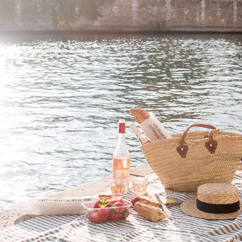 French Market Basket, wine, strawberries, and bread for picnic by the river