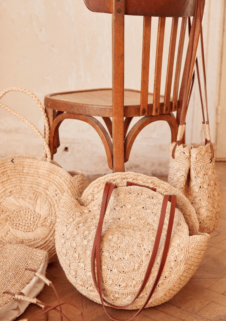 four different designs of french market baskets and a wood chair