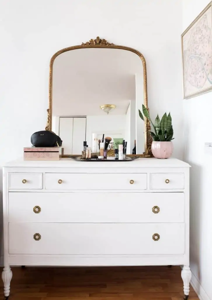 Labor Day furniture and gold mirror on a drawer