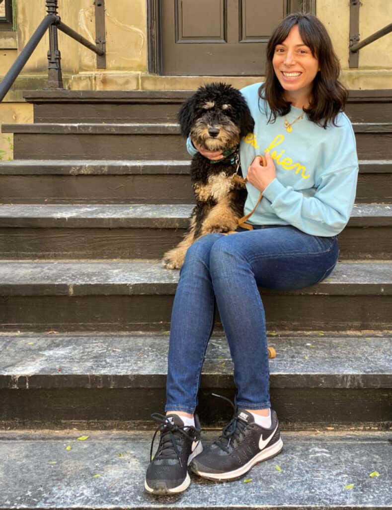 woman and her dog sitting in the stairs for Loved the Most in April