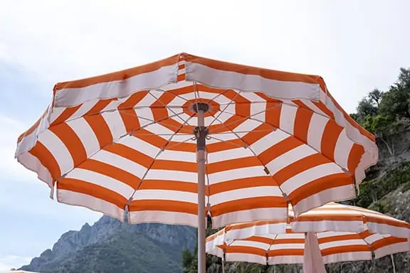 white and orange stripe umbrellas 