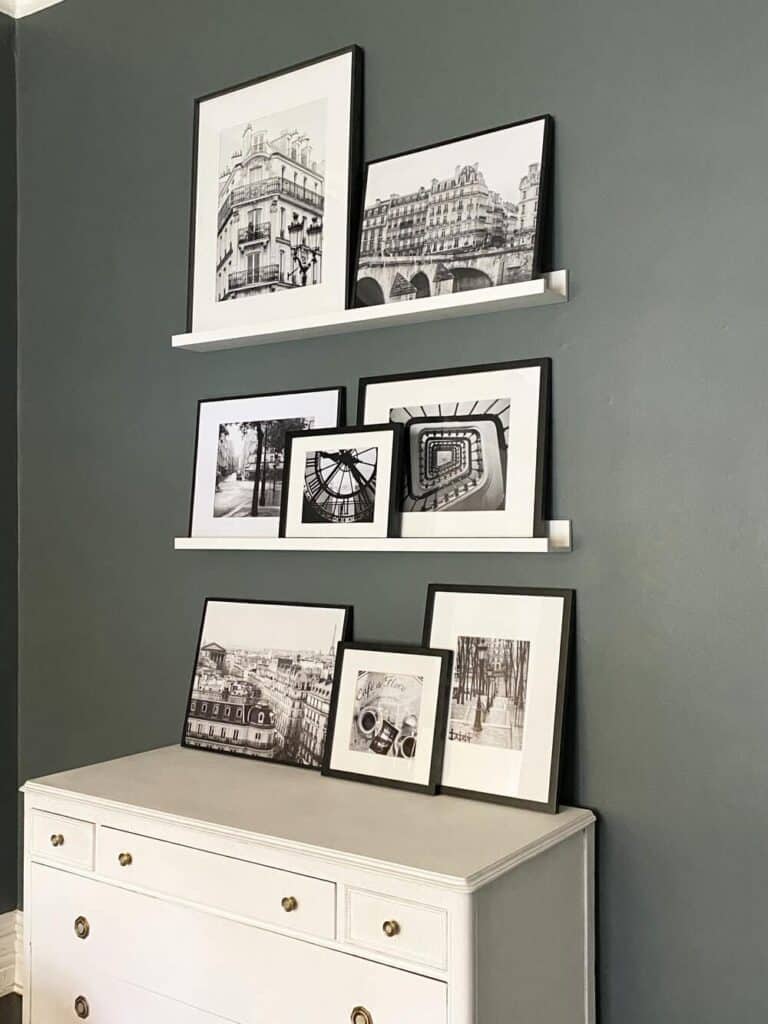 black and white frame set on a gallery wall