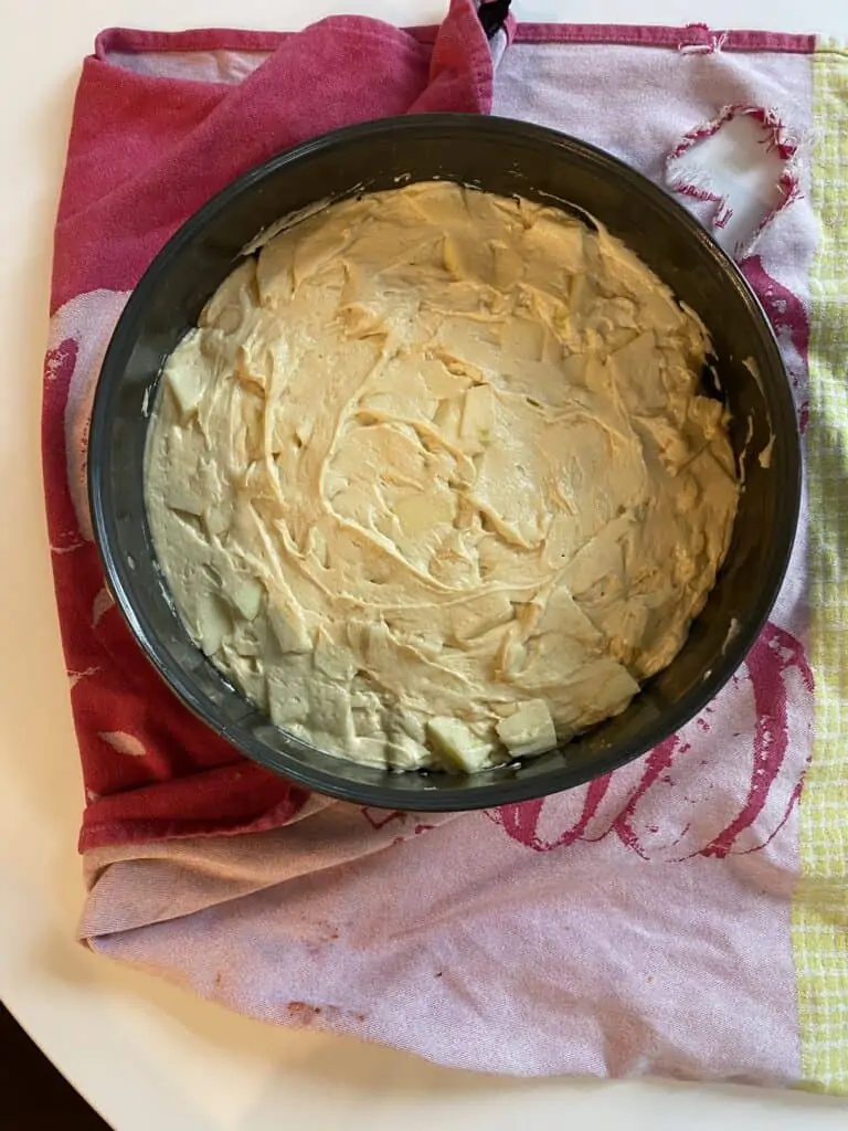 French apple cake ingredients in a baking pan