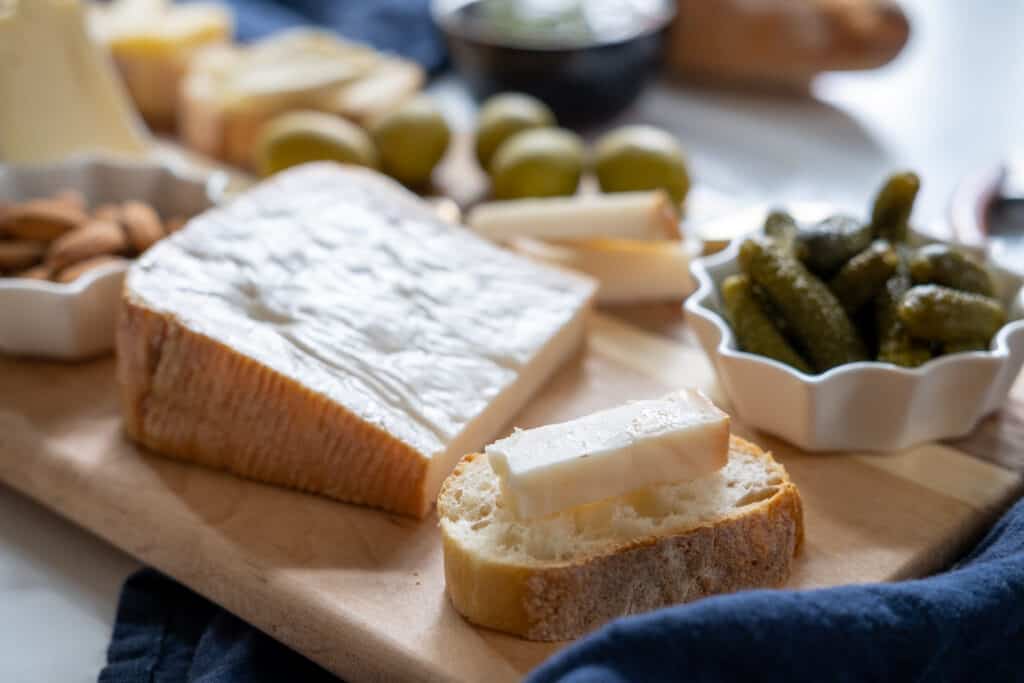 cheese on bread with cornichons 