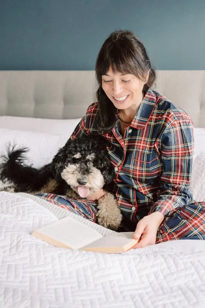 reading on your bed with a dog