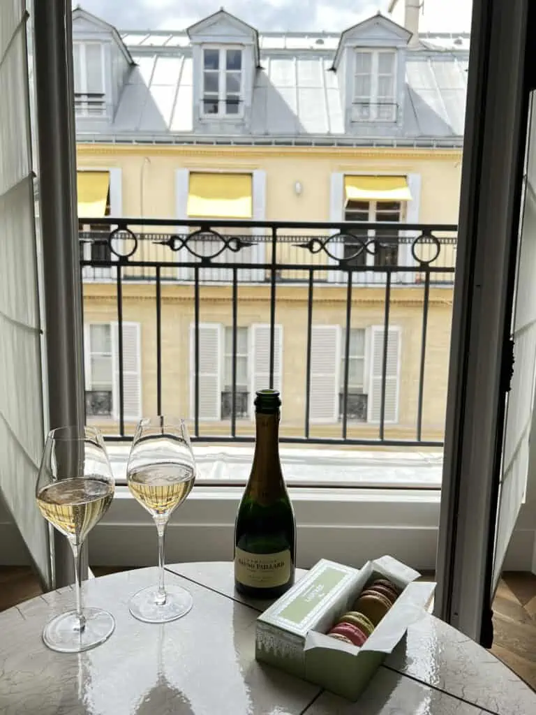 Champagne and macarons in hotel room