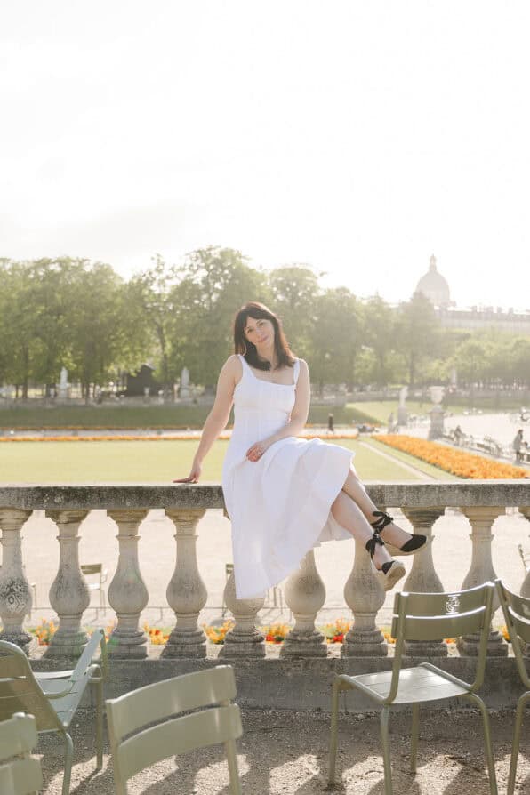 Rebecca Plotnick in white staud dress in Luxembourg Gardens Paris 