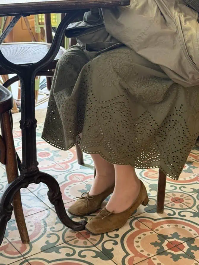 Parisian woman with flats and embroidered skirt