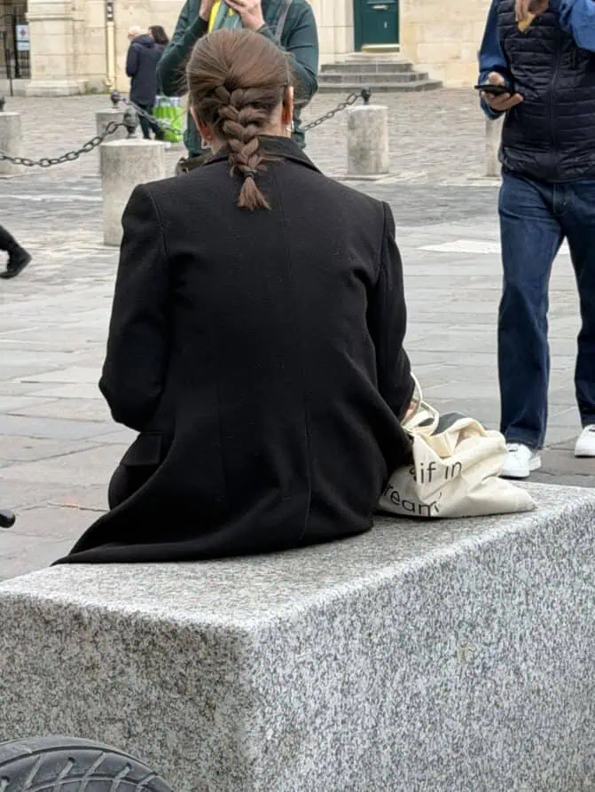 Parisian wearing a blazer and braid