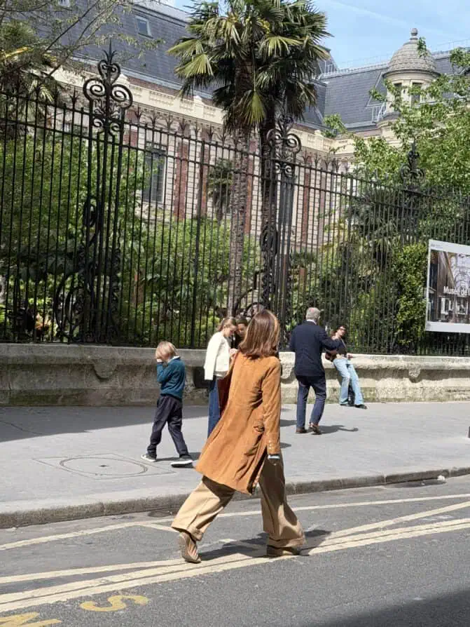 brown suede coat Parisian walking in spring Paris