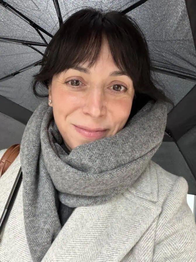 Rebecca Plotnick rain in Paris winter look with grey scarf and grey coat