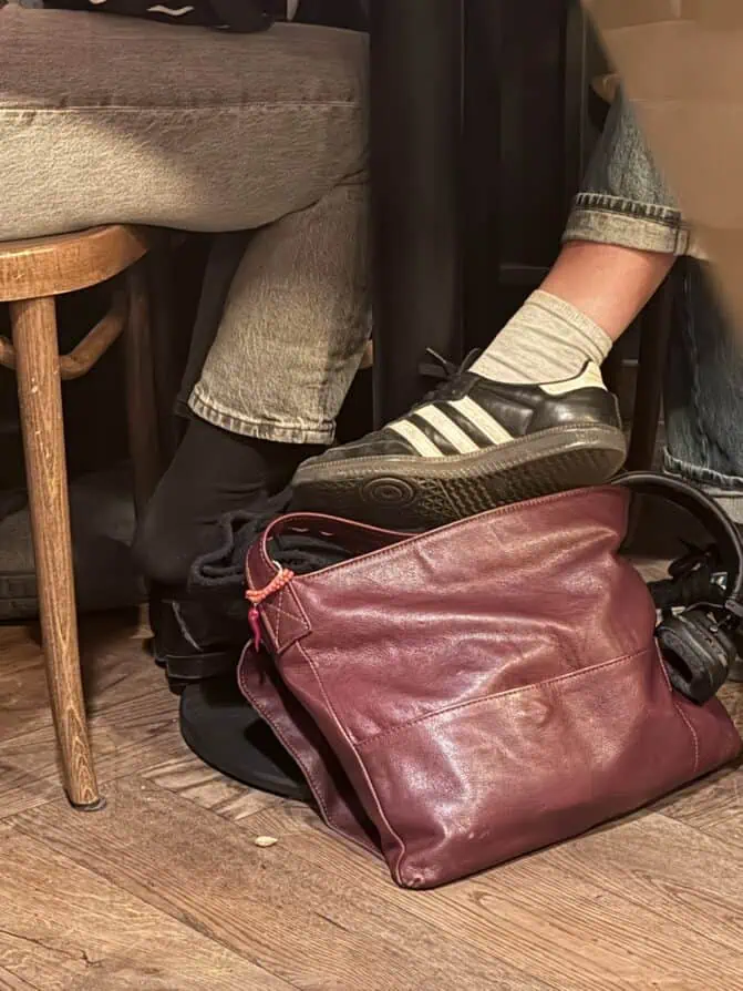Parisian sneakers, red bag, and headphones