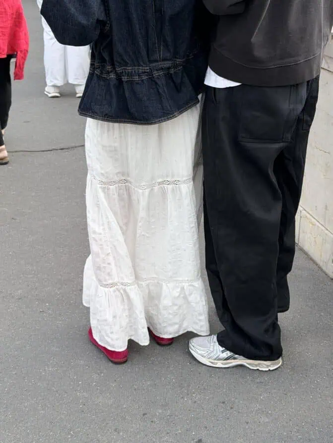 white maxi skirt and bright flats Parisian woman
