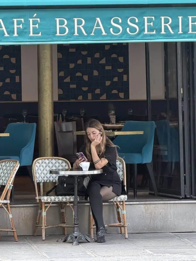 parisian woman in al black with black tights Fall Paris 2026