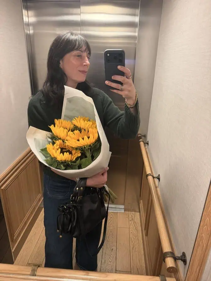 green sweater and Frame jeans Paris
